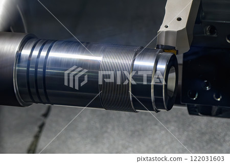 The CNC lathe machine forming  cutting the metal shaft parts. 122031603