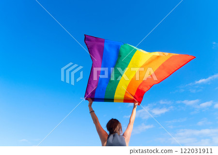 Woman holding lgbt flag Woman holding lgbt flag 122031911