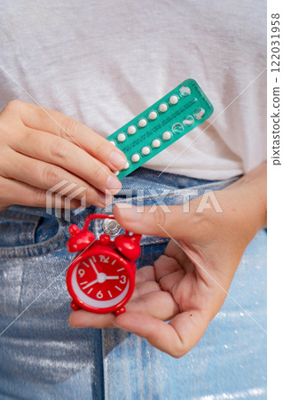woman holding 21 day oral contraceptive pills, birth control and pregnancy planning woman holding 21 day oral contraceptive pills, birth control and pregnancy planning 122031958