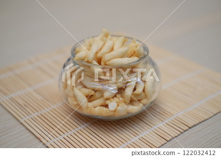 telur gabus sticks in a jar with bamboo mat telur gabus sticks in a jar with bamboo mat 122032412