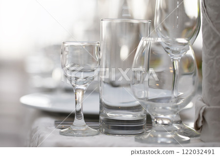 Various glass glasses on the restaurant table. Various glass glasses on the restaurant table. 122032491