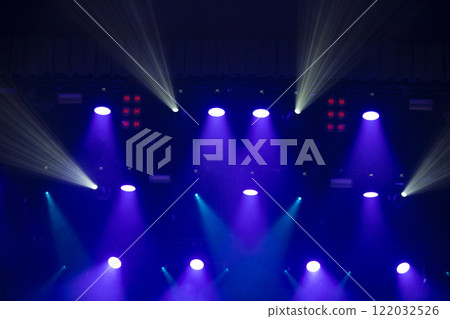Blue background with stage light white and pink beams. Blue background with stage light white and pink beams. 122032526