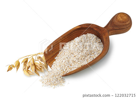 oat bran in scoop and ears near isolated on white 122032715