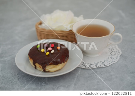 donut and cup on the marble table 122032811