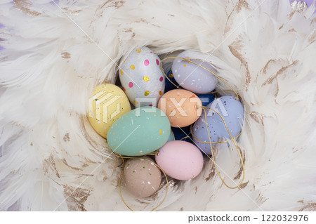 Easter colored eggs in nest Easter colored eggs in nest 122032976