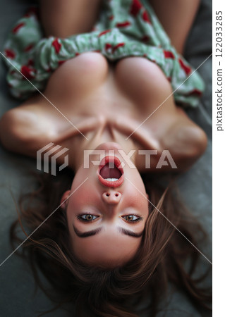 Erotic, sex, masturbation, cunnilingus, porn. Young woman having orgasm. Beautiful woman with open mouth enjoying sex lying in bed, top view. Sexual experience, sensual pleasure. 122033285