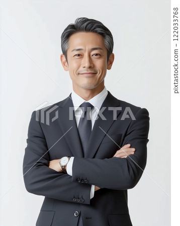 A senior man in a suit with a confident look on his face. Business image 122033768