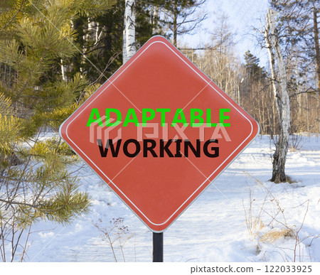 Adaptable working symbol. Concept words Adaptable working on beautiful red road sign. Beautiful forest trees snow background. Business Adaptable working concept. Copy space. Adaptable working symbol. Concept words Adaptable working on beautiful red road sign. Beautiful forest trees snow background. Business Adaptable working concept. Copy space. 122033925