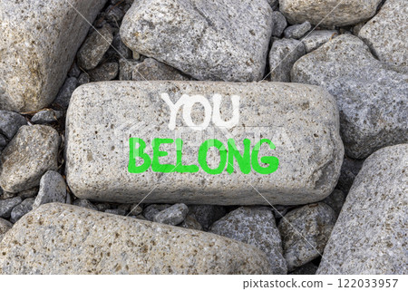 Belonging and you belong symbol. Concept words You belong on beautiful grey stone. Beautiful grey stones background. Business belonging and you belong concept. Copy space. 122033957