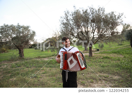 Music Sounds From Accordion In The Green Field 122034255