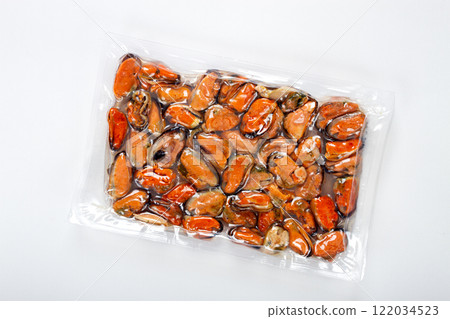 mussels without shell, boiled, mussels, peeled, vacuum packed, top view, on a white background, no people, 122034523
