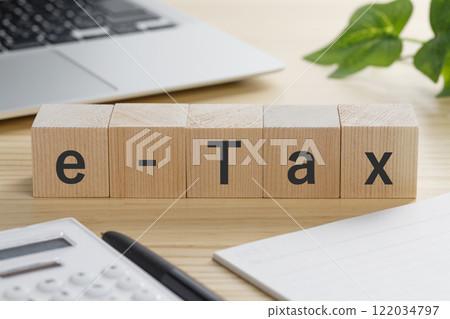 A building block with the words "e-Tax" written on it 122034797