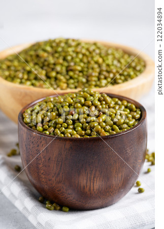 Mung beans nutritious superfood on wooden bowls, close up 122034894