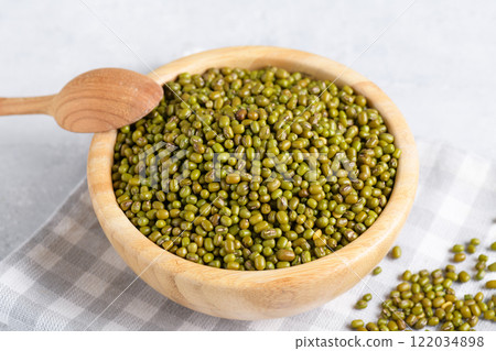 Protein-rich mung beans in a wooden bowl Protein-rich mung beans in a wooden bowl 122034898