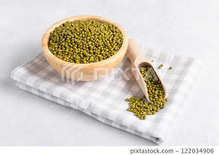 Organic dried mung beans for cooking in wooden bowl 122034906