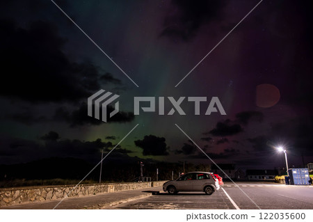 The Aurora Borealis, the northern lights, showing up in Portnoo, County Donegal, Ireland. The Aurora Borealis, the northern lights, showing up in Portnoo, County Donegal, Ireland. 122035600
