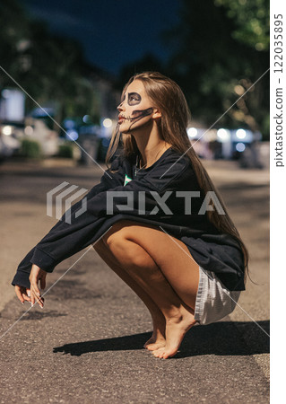 Portrait of creepy teenage girl with Halloween makeup 122035895