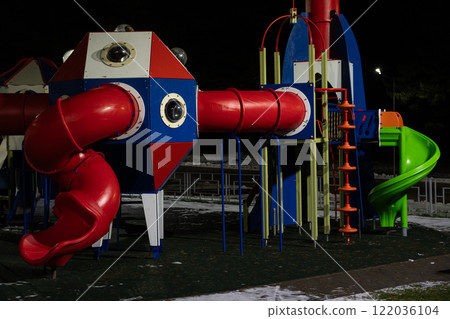 Playground at night in the park under a street lamp 122036104