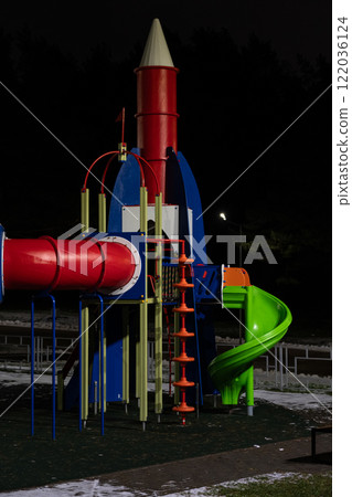 Playground at night in the park under a street lamp Playground at night in the park under a street lamp 122036124