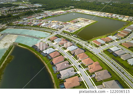 View from above of densely built residential houses under construction in closed living clubs in south Florida. American dream homes as example of real estate development in US suburbs 122036515