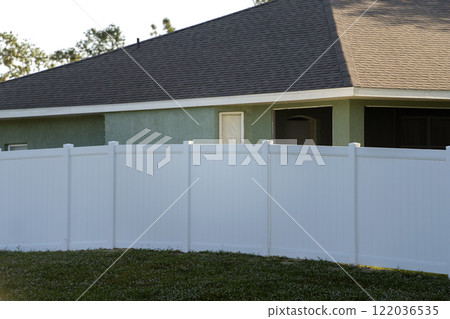 White plastic fence for back yard protection and privacy 122036535
