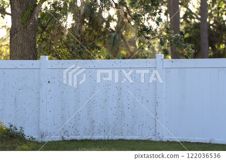 White plastic fence for back yard protection and privacy 122036536