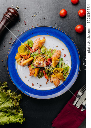 Grilled chicken salad with citrus and greens, a perfect mix of freshness and savory flavors Grilled chicken salad with citrus and greens, a perfect mix of freshness and savory flavors 122036584