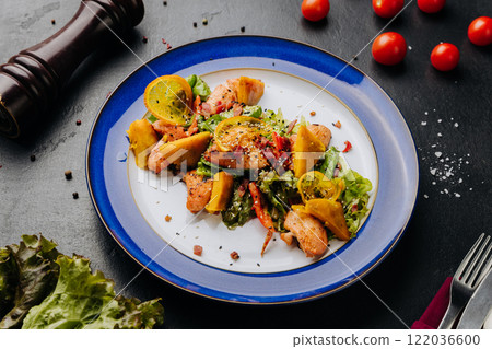 Grilled chicken salad with citrus and greens, a perfect mix of freshness and savory flavors 122036600