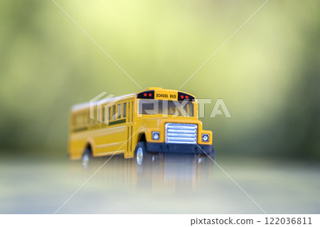 Little model of american yellow school bus outdoor. Concept of education safety in the USA 122036811
