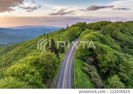Mountain pass road in North Carolina Appalachian mountains, USA. Blue Ridge Parkway in summer season at sunset Mountain pass road in North Carolina Appalachian mountains, USA. Blue Ridge Parkway in summer season at sunset 122036829