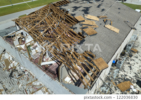 Natural disaster and its consequences. Hurricane Ian destroyed house roof and walls in Florida residential area Natural disaster and its consequences. Hurricane Ian destroyed house roof and walls in Florida residential area 122036830
