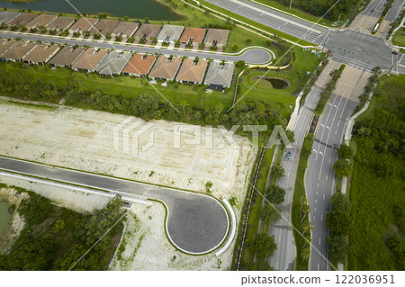 Ground prepared for building of new residential houses in Florida suburban development area. Concept of growing american suburbs Ground prepared for building of new residential houses in Florida suburban development area. Concept of growing american suburbs 122036951