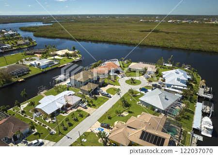 Destroyed by hurricane Ian suburban coastal houses in Florida home residential area. Consequences of natural disaster 122037070