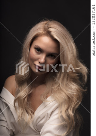 young beautiful woman on a dark background, full length studio shot young beautiful woman on a dark background, full length studio shot 122037161