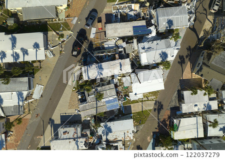 Aftermath of natural disaster in southern Florida. Badly damaged mobile homes after hurricane Ian swept through residential area 122037279
