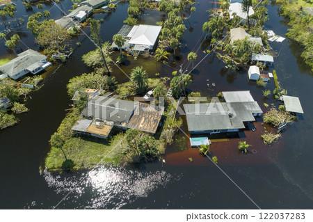 Aftermath of natural disaster. Surrounded by hurricane Ian rainfall flood waters homes in Florida residential area 122037283