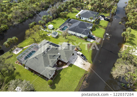 Aftermath of natural disaster. Surrounded by hurricane Ian rainfall flood waters homes in Florida residential area 122037284