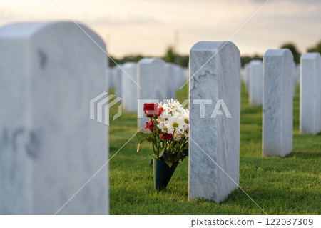 Army veteran cemetery with white headstones. Tombs of retired military soldiers. Memorial Day concept Army veteran cemetery with white headstones. Tombs of retired military soldiers. Memorial Day concept 122037309
