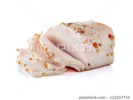 Salted lard with spices isolated on white. Salted lard with spices isolated on white. 122037733