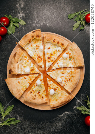 Cheesy pizza slices topped with mini mozzarella, ready to share for the perfect food moment Cheesy pizza slices topped with mini mozzarella, ready to share for the perfect food moment 122038749