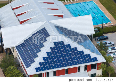 Solar rooftop on commercial center in Florida. Photovoltaic panels for producing of clean ecological electrical energy in city urban area. Concept of autonomous building 122039347
