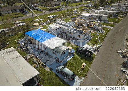 Severely damaged by hurricane Ian houses in Florida mobile home residential area. Consequences of natural disaster Severely damaged by hurricane Ian houses in Florida mobile home residential area. Consequences of natural disaster 122039363