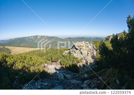 Rocky mountain hillside with big stone boulders on sunny day Rocky mountain hillside with big stone boulders on sunny day 122039374