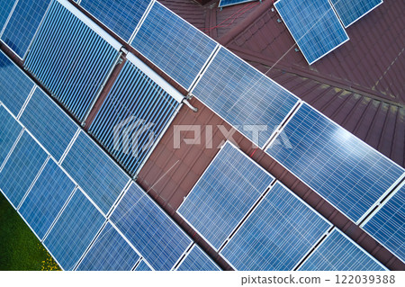Residential house with rooftop covered with solar photovoltaic panels for producing of clean ecological electrical energy in suburban rural area. Concept of autonomous home 122039388