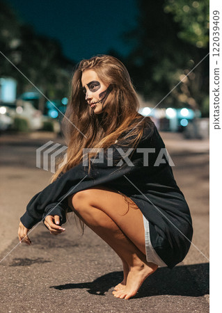 Portrait of creepy teenage girl with Halloween makeup 122039409