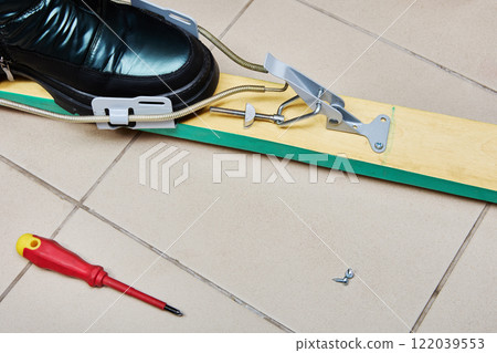 Installation of universal ski binding with cable spring and an adjustable tension lever. Installation of universal ski binding with cable spring and an adjustable tension lever. 122039553