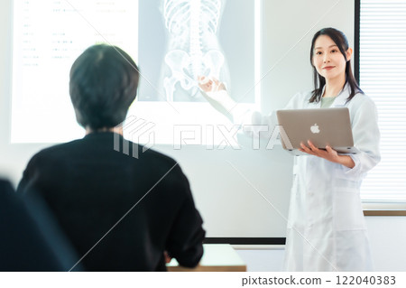 Female doctor presenting research Female doctor presenting research 122040383
