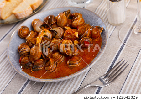 Snails tapa - Andalusia traditional food on table 122042829