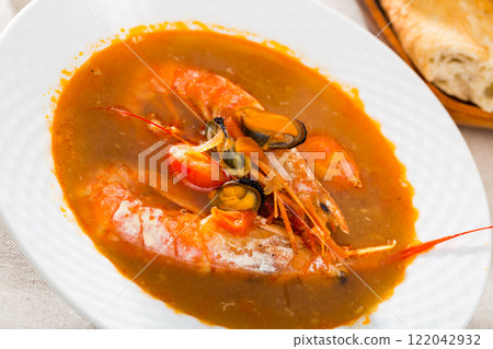 Spicy seafood soup with king prawns 122042932
