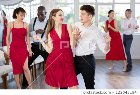 Young guy and young woman dance twist Young guy and young woman dance twist 122043184